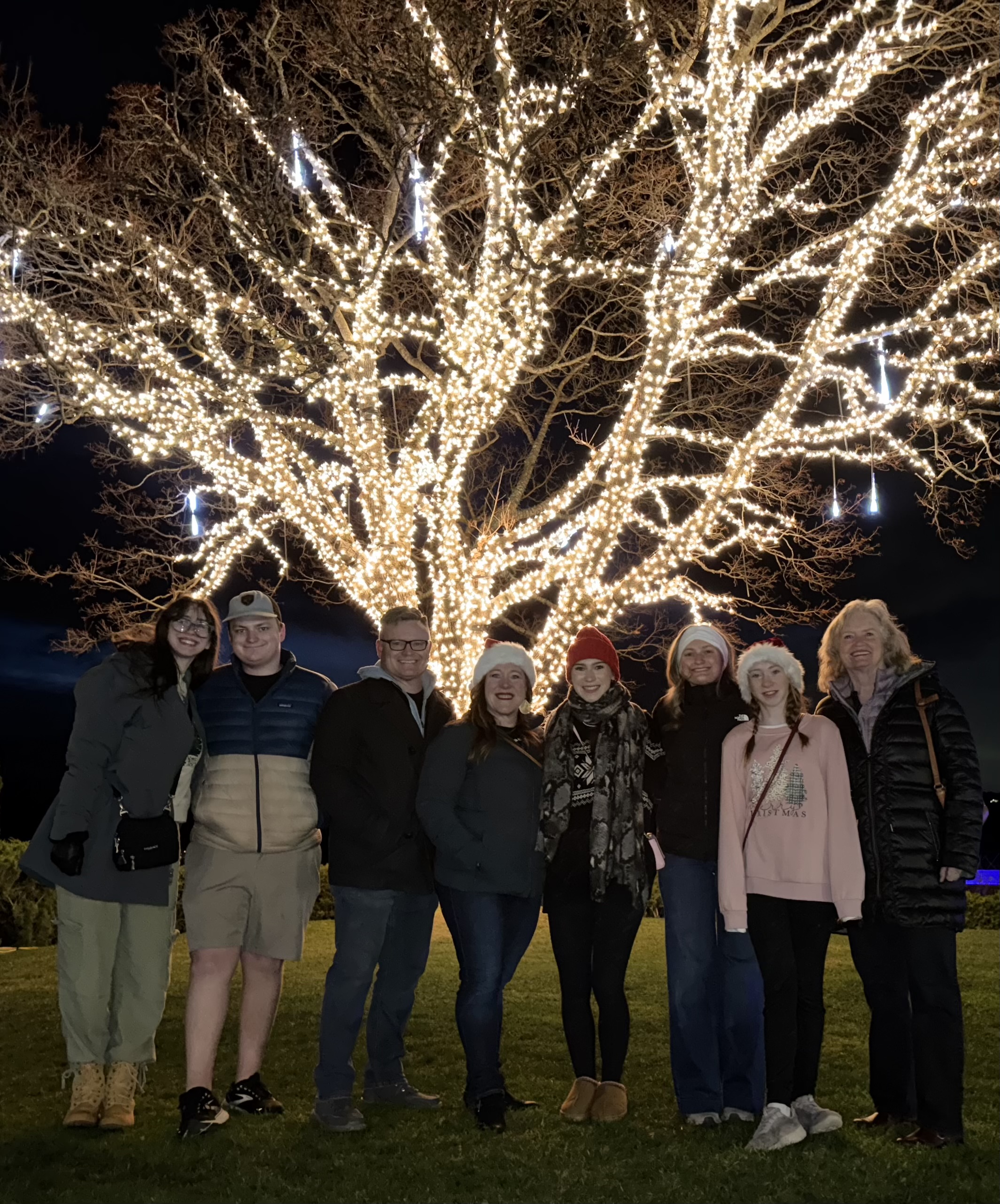 Tim, Leanne, and their family under the lights